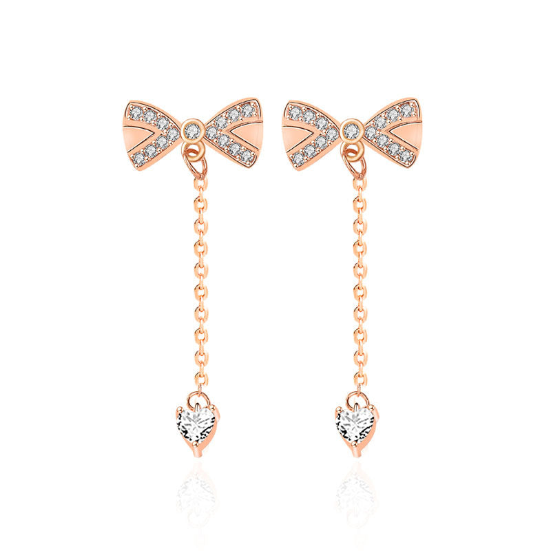 Crystal Bow Drop Earrings - Rose Gold Earrings with Dangling Chain and Heart Detail