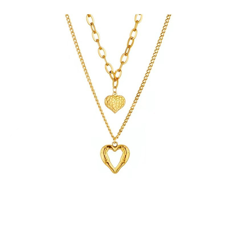 gold angel wings heart 2 piece necklace set on white background