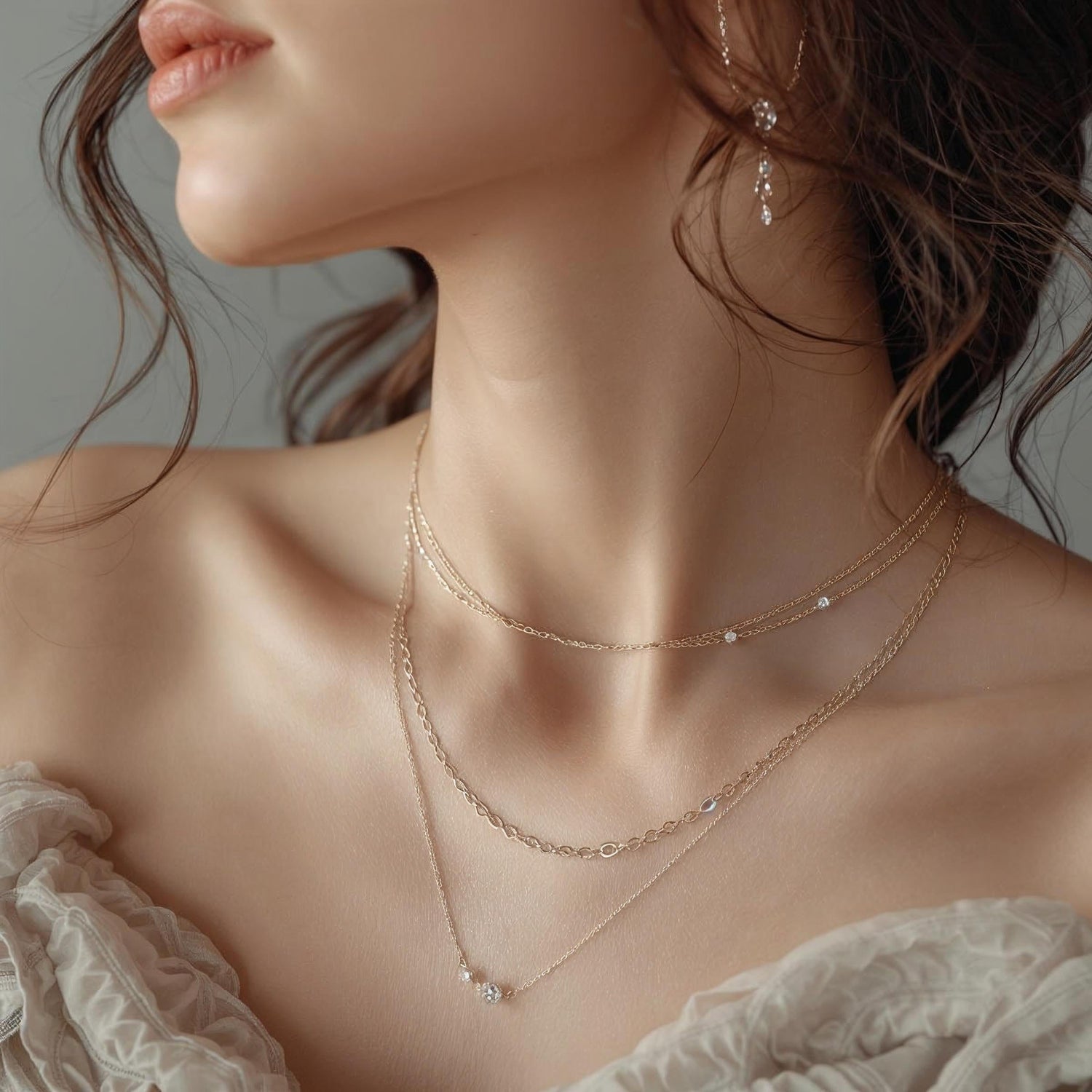 Close-up of elegant woman wearing layered delicate necklaces, graceful neck and collarbone. Soft natural light, neutral tones, editorial fashion photography, sophisticated and timeless