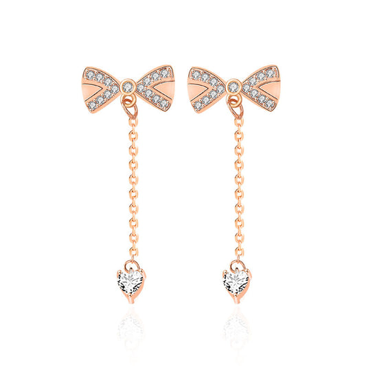 Crystal Bow Drop Earrings - Rose Gold Earrings with Dangling Chain and Heart Detail
