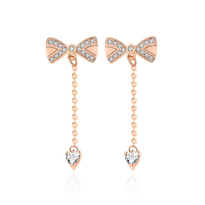Crystal Bow Drop Earrings - Rose Gold Earrings with Dangling Chain and Heart Detail