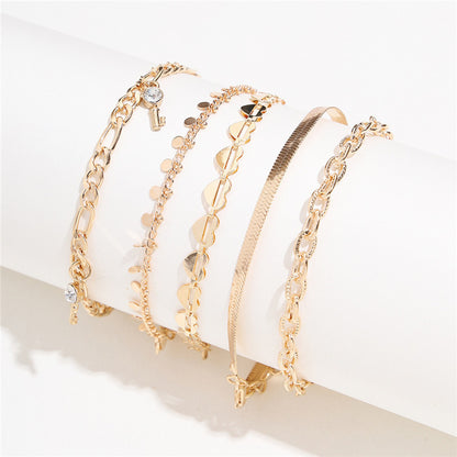 5-Piece Boho Gold Anklet Set - Layered Chain Stack with Heart and Charm Details