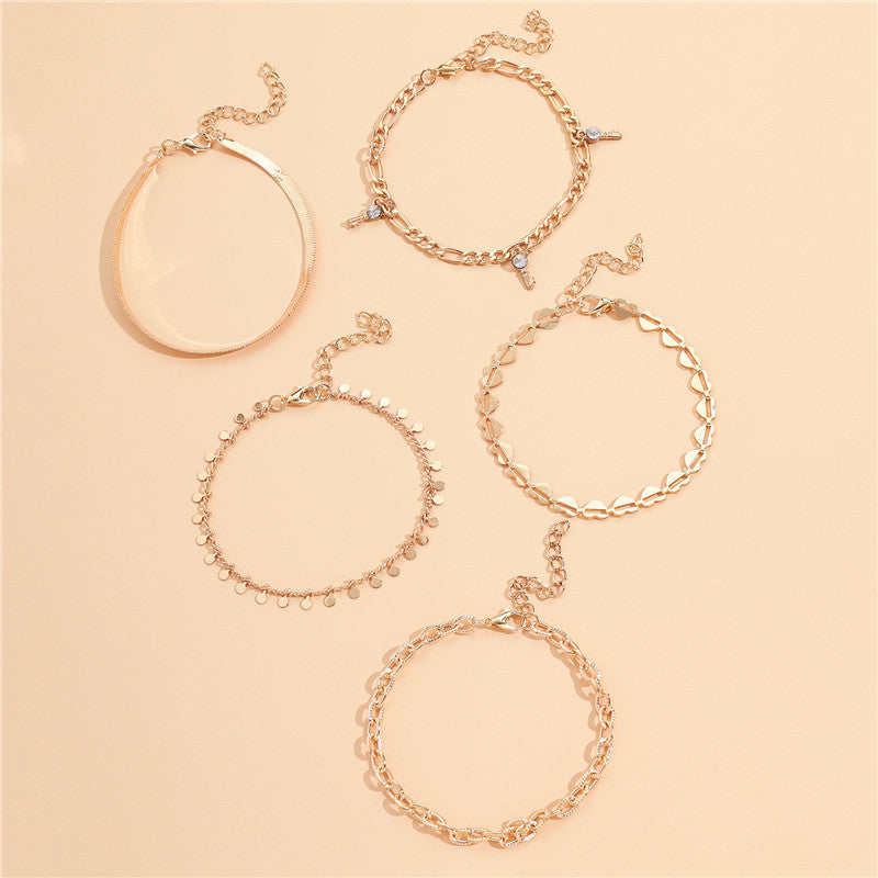 5-Piece Boho Gold Anklet Set - Layered Chain Stack with Heart and Charm Details