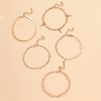 5-Piece Boho Gold Anklet Set - Layered Chain Stack with Heart and Charm Details