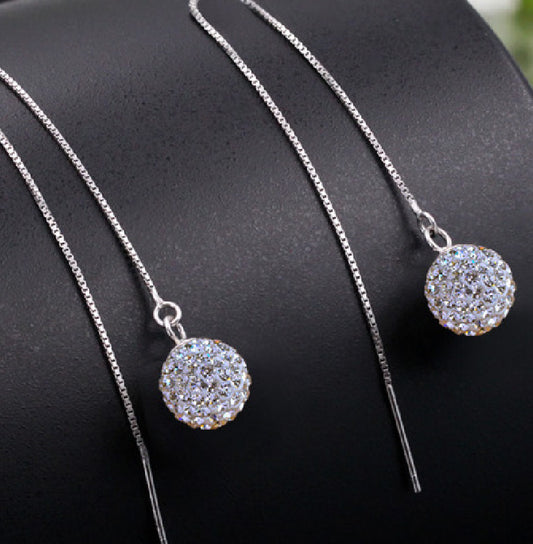 crystal pull through earrings on  black