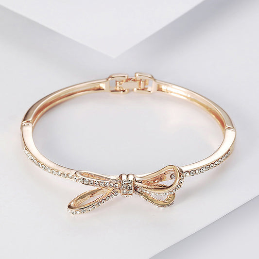 Crystal Bow Bangle Bracelet - Rose Gold Hinged Cuff with Sparkling Ribbon Design