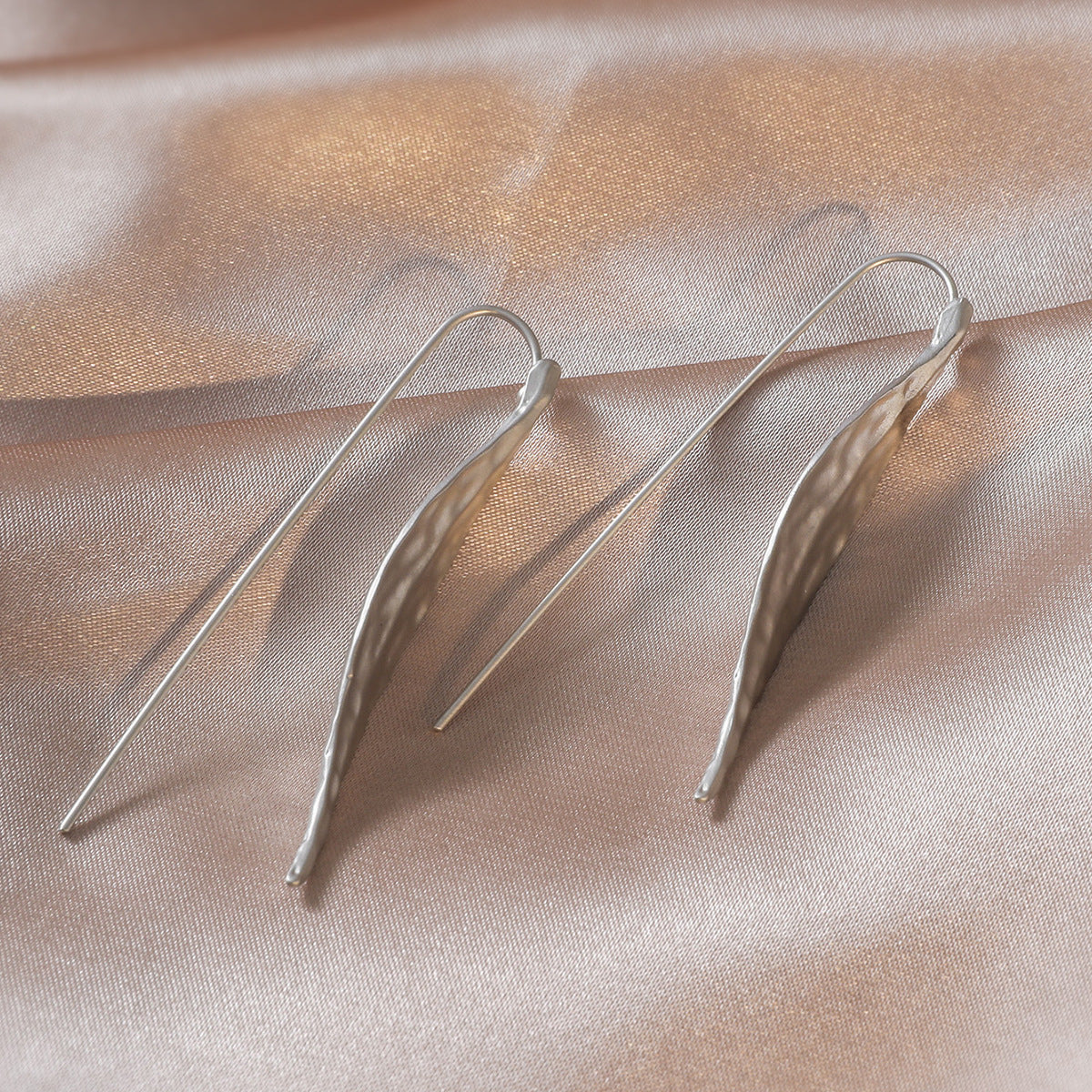 silver leaf earrings on side